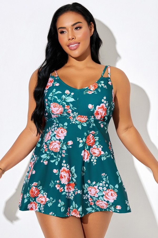 Traje de baño con tirantes dobles y estampado floral sobre fondo verde