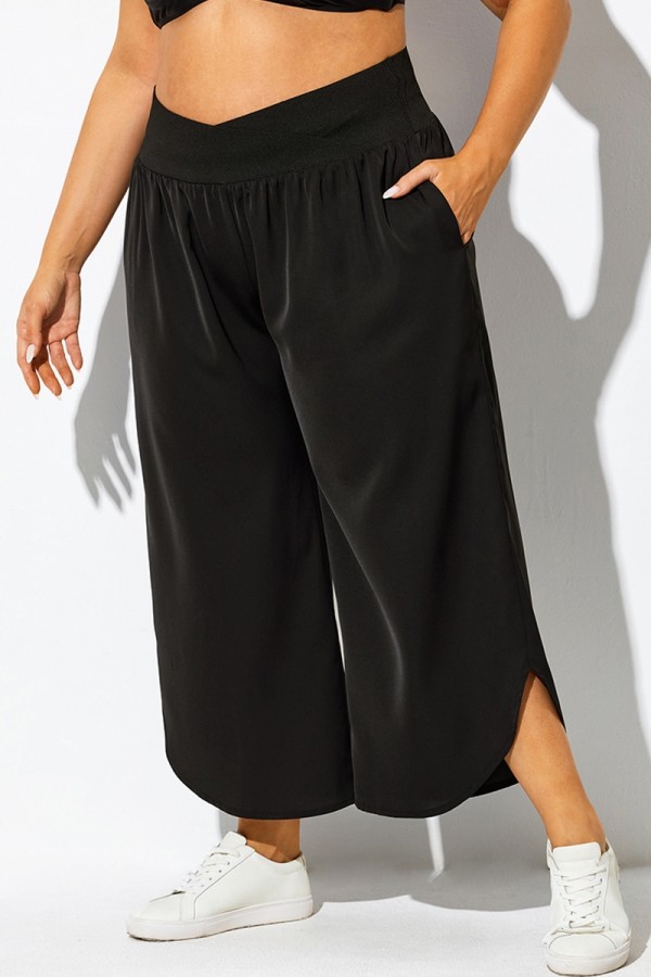 Pantalones negros de secado rápido con bolsillos cruzados y plisados