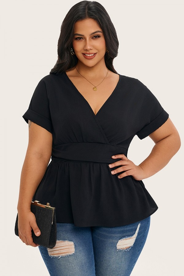 Blusa con cintura ceñida y manga de murciélago de color liso