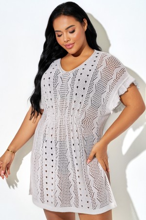 Vestido playero blanco con escote en V y dobladillo con abertura