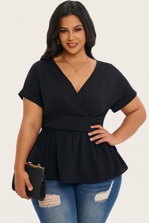Blusa con cintura ceñida y manga de murciélago de color liso